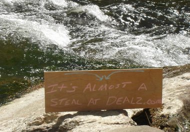 write your message on a sign by a swift river and take a high resolution photo big2