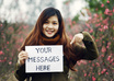 take nice pictures holding a handwritten sign of your website or business at CHERRY blossom field small3