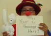 dress up in a clown hat and nose holding a message and send hd pictures small3