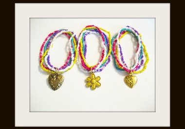 send you a stretch bracelet made of five strands of seed and bugle beads with a cute goldtone charm, US addresses only, big3