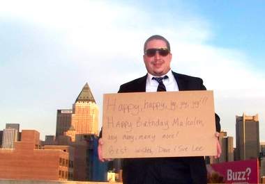 take a picture holding your message on a NYC rooftop big3