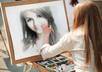make your any photo appear as a girl is painting it with water colors in a street small3