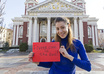 Holding sign