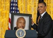 have President Obama holding up Your Picture during a Press Conference