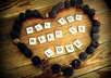 write anything you want in scrabble letters and decorate it with tree seeds Rustic Style on a wooden floor and send you the picture
