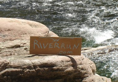 write your message on a sign by a swift river and take a high resolution photo big1