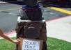 take 5 high quality photos holding your custom message in front of Hawaii Five O star Jack Lord statue