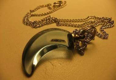 write a name on a grain of rice and place it in a blue crescent pendant necklace big1