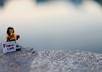 take a photo of a lego hula girl holding your website address, message, etc by a pool