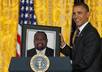 show President Obama holding your photo