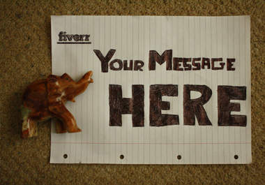 write anything you want on a page and make you an animation with a stone elephant figurine walking over it big1