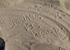 write your name or short message on the beach sand and take a high res picture of it