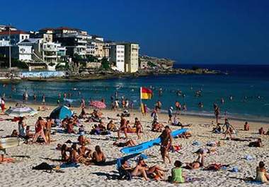 hold up a sign at Bondi Beach, Sydney, Australia saying anything you want on it big1
