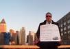 take a picture holding your message on a NYC rooftop