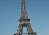 hold your sign in front of the Eiffel Tower