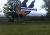 do a side flip while holding your sign small1