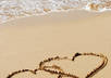 write your and your spouse name or anything, in the sand and take a picture