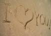 write your message in the sand at the beach and take a picture