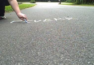 create a video of me writing your website name in sidewalk chalk in double time big1