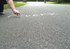 create a video of me writing your website name in sidewalk chalk in double time