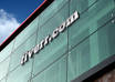 place your business or personal LOGO on a tall building with blue sky above it as a mockup